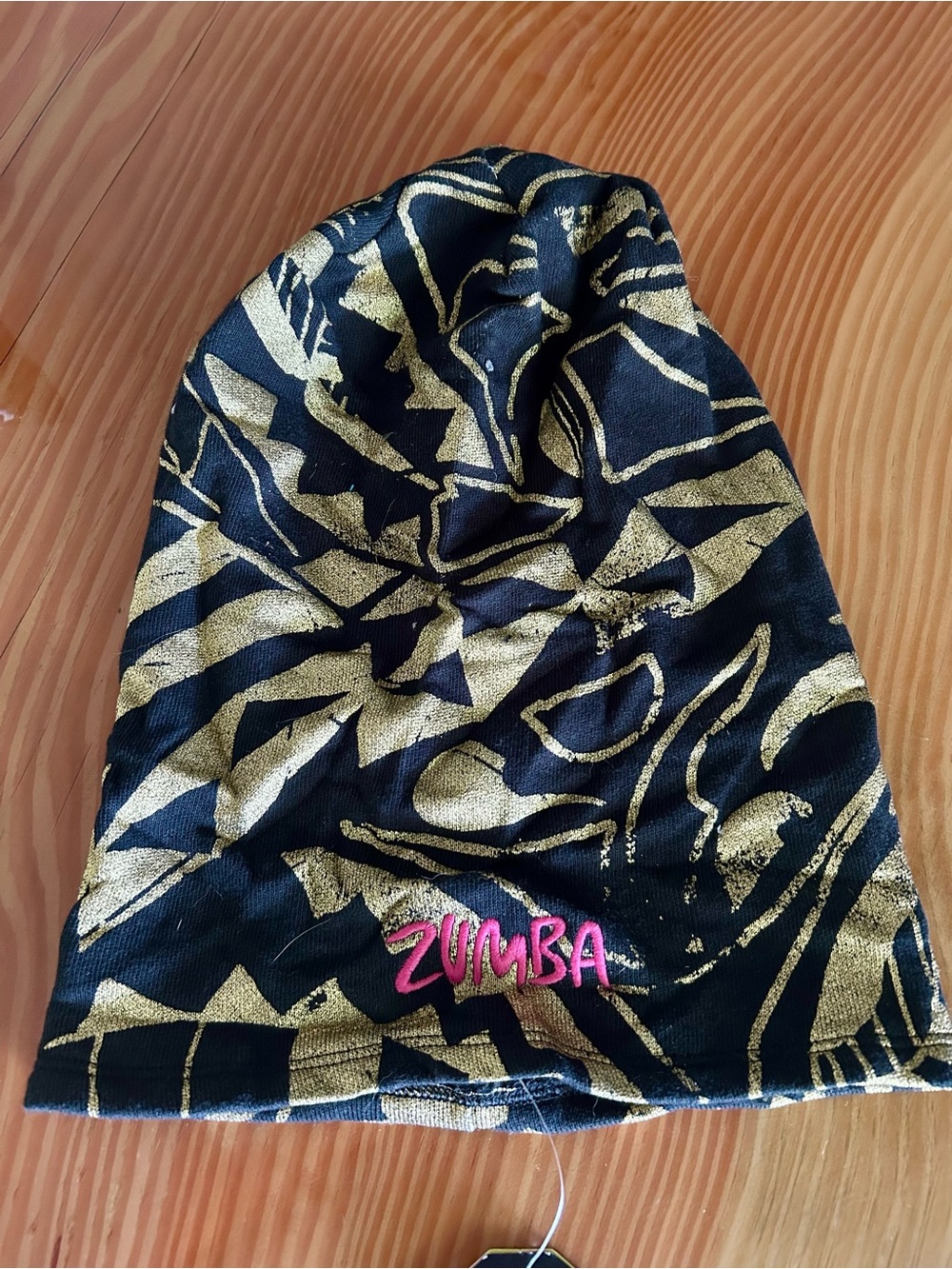 Zumba Fitness Black and Gold Patterned Slouch Beanie with Pink Logo